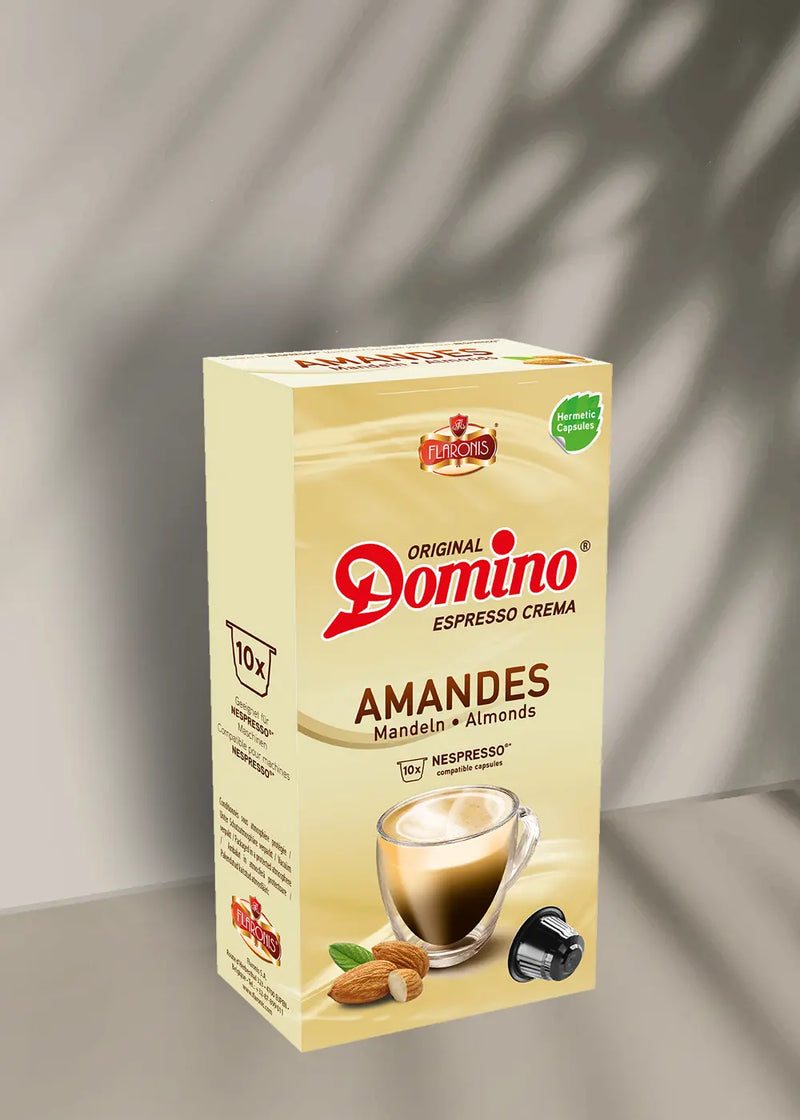 Découvrez le plaisir d'un expresso haut de gamme avec les dosettes saveur amande « Amandes » de Capsules Café Domino, compatibles avec les machines Nespresso. Chaque boîte comprend 10 capsules riches et savoureuses. L'emballage chaleureux met en valeur une tasse de café et des amandes, créant l'ambiance parfaite pour votre pause-café. Offrez-vous une expérience délicieuse à chaque gorgée grâce à ces dosettes espresso crema fabriquées avec soin par Domino. | Flaronis.lu